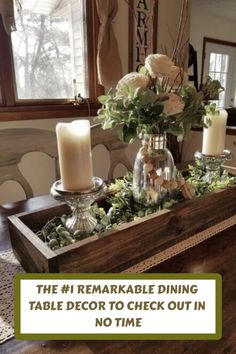 a table with candles and flowers on it in front of a window that says, the 1 remarkable dining table decor to check out in no time