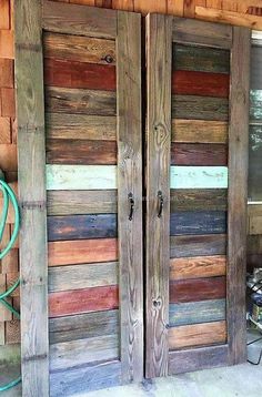 two large wooden doors sitting next to each other