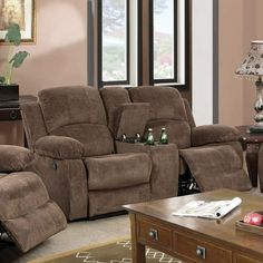 a living room with two recliners and a coffee table