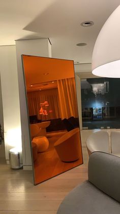 the reflection of a living room in a mirror