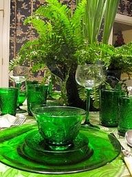 green glass dishes and glasses on a table