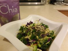 a white bowl filled with salad next to a bag of chia seeds