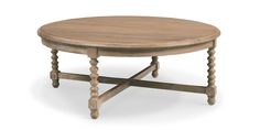 a round wooden table with turned legs on an isolated white background for use as a coffee table