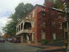 a red brick building with white balconies