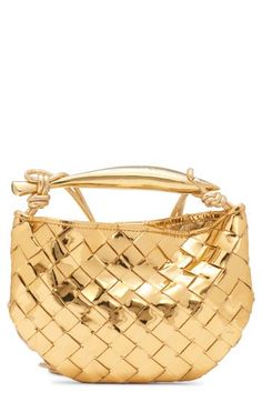 A sardine-inspired sculptural handle brings an artisanal touch to this compact bag crafted of metallic lambskin in the label's signature intrecciato weave. Magnetic closure Top carry handle; crossbody strap Unlined Leather Made in Italy Designer Handbags Gold Rectangular Bag With Intrecciato Weave, Elegant Gold Shoulder Bag With Intrecciato Weave, Compact Bag, Gold Bag, Woman Bags Handbags, Gold Brass, Bago, Crossbody Strap, Magnetic Closure