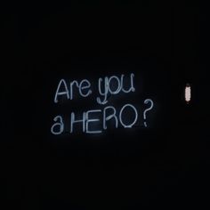 a neon sign that says are you a hero? in white writing on a black background