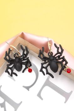 How fun is this spider for Halloween spider earrings. This will be perfect on your Halloween costume.matching necklace: 10N3060102DIMENSION length: 1.75"width: 1" earring back: Postmetal finish: Gold Platingproduct: Lead & Nickel Compliantanti-tarnish: Double E-coating Black Spooky Jewelry For Party, Spooky Black Jewelry For Party, Black Novelty Jewelry For Party, Novelty Black Jewelry For Party, Black Spooky Party Jewelry, Spooky Black Earrings For Party, Novelty Black Earrings For Party, Black Novelty Drop Earrings, Spooky Black Jewelry For Halloween