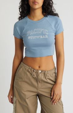 Raglan sleeves bring a sporty vibe to a logo-stamped crop top cut from soft, stretchy jersey. 16" length (size Medium) Crewneck Short sleeves 95% cotton, 5% spandex Machine wash, tumble dry Imported Pacsun Logo, Crop T Shirt, Sports Tees, Crop Tshirt, Baby Tee, Pacsun, Infant Tees, Raglan Sleeve, Crop Top