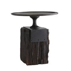 a wooden table with an iron base and black wood grain on the top, against a white background