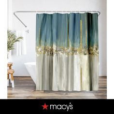 a shower curtain with an image of the city skyline in blue and gold on it