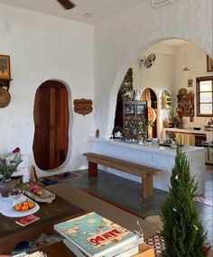 a living room filled with lots of furniture and decor