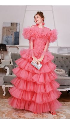 Evening Tiered Tulle Gown, Tiered Tulle Gown For Evening, Pink Tulle Tutu Dress For Evening, Evening Gown With Attached Cancan In Tulle, Red Tulle Gown With Ruffles, Tulle Tutu Dress For Prom And Party Season, Prom Tulle Tutu Dress For Party Season, Fitted Tiered Tulle Ball Gown, Red Tulle Tutu Dress For Prom