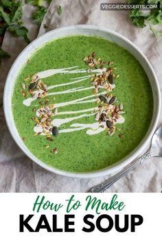 a bowl filled with green soup and topped with nuts