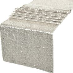 a stack of silver glitter napkins sitting on top of each other in front of a white background