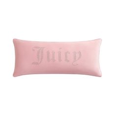 a pink pillow with the word juicy in silver sequins on it's side