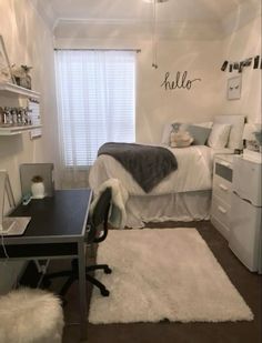 a bedroom with a bed, desk and white rug