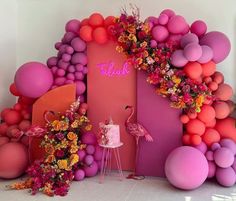 a flamingo themed birthday party with balloons and flowers