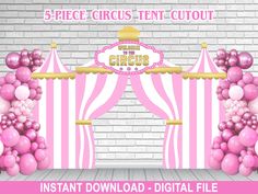 a pink and white circus tent with balloons