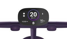 an image of a digital clock on the front of a bike handle with purple accents