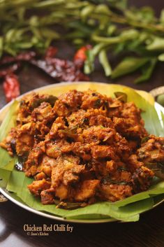 chicken red chili fry served on a banana leaf