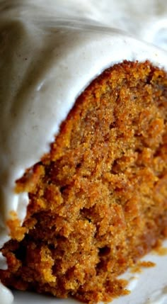 a piece of carrot cake with icing on a plate