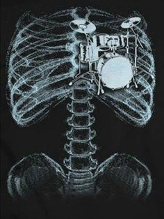 an x - ray image of a skeleton with drums on it's chest and ribs