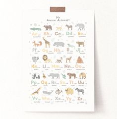 an animal alphabet poster hanging on a wall