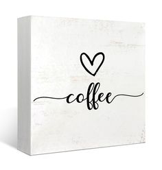 a white box with the word coffee written on it and a heart in the middle