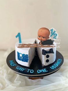 a cake with a baby in the middle on top of it