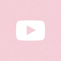 a pink background with a white play button on it's left side and an arrow in the center