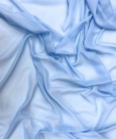 Baby Blue Chiffon Fabric By The Yard, Light Blue Sheer Chiffon Fabric for Drapes,  Baby shower, Dress, Table Runner Chiffon is a light, see-through fabric that flows nicely. Machine washable, chiffon fabric has a beautiful flowing drape and a soft touch. Thin and lightweight, insert a lining as it is sheer. It's often used for apparel, fashion, dance wear, scarves, costumes, wedding and baby shower decor, maxi dresses, gowns, backdrops, wedding table runners and home decor projects.   Sells by t Drapes Dresses, Chiffon Draping, Dress Table, Backdrops Wedding, Blue Chiffon Dresses, Light Blue Fabric, Shower Dress, Draping Fabric, Table Runners Wedding