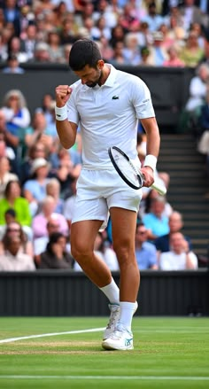 a man holding a tennis racquet on top of a tennis court