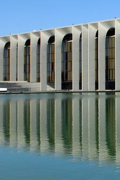 an image of a building that looks like it is in the middle of some water