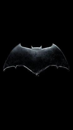 the dark knight batman logo on a black background