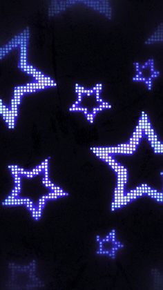 some blue and white stars on a black background