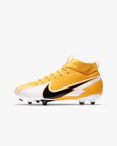 a pair of yellow and black soccer cleats