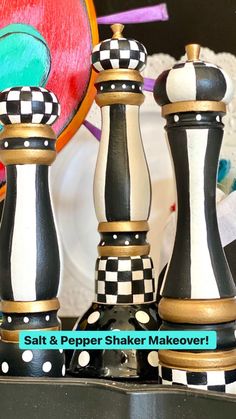 three black and white chess pieces sitting next to each other