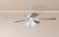 a white ceiling fan with three wooden blades and two light bulbs on the top of it