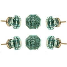 four pairs of green glass knobs on white background