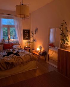 a bed room with a neatly made bed next to a window