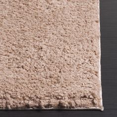 an area rug that looks like it is made out of wool and has been placed on the floor