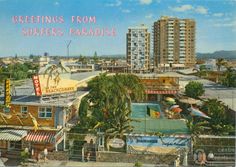 an old postcard with the words greetings from surfers paradise in front of some buildings