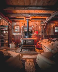 a living room filled with furniture and a wood stove