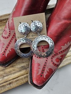 Gorgeous western drop earrings that will go go with so many different outfits! Perfect for concerts, date night, or everyday wear. Earrings measure 3" long and 1.75" wide. Silver Concho Earrings For Gift, Silver Concho Earrings As A Gift, Decorative Silver Earrings As Gift, Concho Drop Earrings, Adjustable Stamped Dangle Earrings, Stamped Dangle Jewelry, Southwestern Style Metal Earrings For Gift, Southwestern Metal Earrings For Gift, Concho Dangle Earrings For Gift