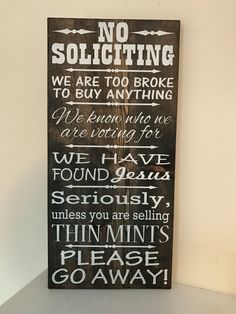 a wooden sign that says no soliciing we are too broke to buy anything