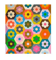 a multicolored rug with hexagons and flowers on the bottom half