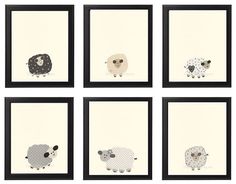 four framed pictures with sheep on them in black and white frames, each one has a different color scheme