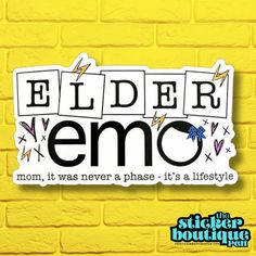 a sticker that says elder emo on the side of a yellow brick wall