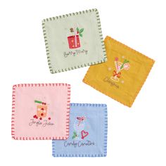 three napkins with designs on them sitting side by side in the shape of christmas gifts