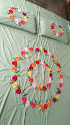 an image of a bed with flowers on the comforter and pillow cases in it